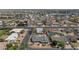 Aerial view of a home with a backyard pool in a neighborhood, showcasing its location and surrounding landscape at 524 W Sunset Cir, Mesa, AZ 85201