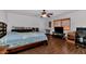Bedroom with wood floors, a ceiling fan, and ample space at 524 W Sunset Cir, Mesa, AZ 85201