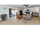 Spacious living area featuring a fireplace, sliding glass doors to the patio, and tile flooring throughout at 524 W Sunset Cir, Mesa, AZ 85201