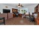 This office has tile flooring, a ceiling fan, a large window and built in cabinetry at 524 W Sunset Cir, Mesa, AZ 85201