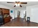 The office contains built in cabinetry, a ceiling fan, and tile flooring at 524 W Sunset Cir, Mesa, AZ 85201