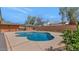 This backyard has a sparkling pool, brick privacy wall and a built in bar area at 524 W Sunset Cir, Mesa, AZ 85201