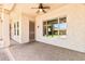 Comfortable covered back porch with brick pavers and large windows overlooking the yard at 5541 W Desperado Way, Phoenix, AZ 85083