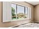 Bedroom with carpet and a large window overlooking a well-maintained backyard at 5541 W Desperado Way, Phoenix, AZ 85083