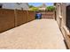Spacious brick driveway offers ample parking space, adjacent to block wall and gate at 5541 W Desperado Way, Phoenix, AZ 85083
