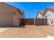 Paver driveway and entry gate between the garage and the house at 5541 W Desperado Way, Phoenix, AZ 85083