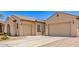 Spacious three-car garage with paved driveway, enhancing curb appeal at 5541 W Desperado Way, Phoenix, AZ 85083