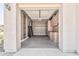 Garage interior featuring built-in shelving and cabinets at 5541 W Desperado Way, Phoenix, AZ 85083