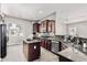 Modern kitchen with granite countertops, stainless steel appliances, and ample cabinetry at 5541 W Desperado Way, Phoenix, AZ 85083