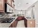 Gourmet kitchen with granite counters, stainless appliances, and a gas cooktop at 5541 W Desperado Way, Phoenix, AZ 85083