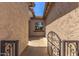 Exterior shot showcasing the gated side yard featuring well-maintained stucco walls at 5541 W Desperado Way, Phoenix, AZ 85083