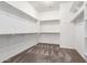 Walk-in closet with carpeted floors, multiple shelves, and plenty of storage space at 5541 W Desperado Way, Phoenix, AZ 85083
