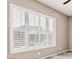 Large window with shutter-style blinds allowing plenty of natural light into the room at 5541 W Desperado Way, Phoenix, AZ 85083