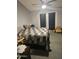 This bedroom features a ceiling fan and a glass door which leads to an outdoor area at 6036 W Mescal St, Glendale, AZ 85304