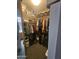 Walk-in closet with clothing racks and storage space, adjacent to a connected bathroom at 6036 W Mescal St, Glendale, AZ 85304