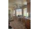 Eat-in kitchen with lots of natural light, tile floors, a ceiling fan, and a view to the backyard at 6036 W Mescal St, Glendale, AZ 85304