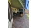 Spacious covered patio with tile flooring, comfortable seating, and a view of the landscaped backyard at 6036 W Mescal St, Glendale, AZ 85304