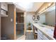 Bright bathroom boasts dual sinks, lots of counter space, a skylight, and a glass enclosed shower at 7368 E Pleasant Run, Scottsdale, AZ 85258