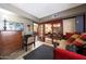 Cozy bedroom with a desk, a daybed, and sliding glass doors to the living room at 7368 E Pleasant Run, Scottsdale, AZ 85258