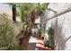 Charming courtyard with lush greenery, potted plants, and brick pavers at 7368 E Pleasant Run, Scottsdale, AZ 85258