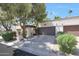 Charming home featuring a two-car garage, mature trees, and meticulously maintained landscaping at 7368 E Pleasant Run, Scottsdale, AZ 85258