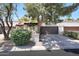 Charming home featuring a two-car garage, mature trees, and meticulously maintained landscaping at 7368 E Pleasant Run, Scottsdale, AZ 85258