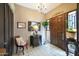 Elegant foyer with decorative tile flooring and a stylish chandelier at 7368 E Pleasant Run, Scottsdale, AZ 85258