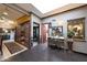 Hallway with wood floors, closet, decorative table with mirror, and access to other rooms at 7368 E Pleasant Run, Scottsdale, AZ 85258