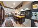 Open-concept kitchen with island seating, modern appliances, and access to the living room at 7368 E Pleasant Run, Scottsdale, AZ 85258