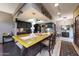Open concept kitchen with a breakfast bar, dark cabinets, and unique decorative elements at 7368 E Pleasant Run, Scottsdale, AZ 85258