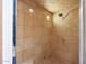 Tile shower with tiled walls, shower head, and seat for a luxurious bathing experience at 7368 E Pleasant Run, Scottsdale, AZ 85258