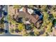 Expansive home featuring a clay tile roof, desert landscaping and a large motor court at 7552 E Whisper Rock Trl, Scottsdale, AZ 85266