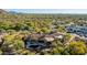 Luxury estate boasting a clay tile roof, mature landscaping, a resort style pool and expansive desert scenery at 7552 E Whisper Rock Trl, Scottsdale, AZ 85266