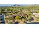 Custom estate with mountain views, mature landscaping, a clay tile roof and multiple courtyards at 7552 E Whisper Rock Trl, Scottsdale, AZ 85266