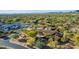 Beautiful home with a clay tile roof and desert landscaping with mature landscaping and an outdoor courtyard at 7552 E Whisper Rock Trl, Scottsdale, AZ 85266