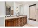 Bathroom featuring double vanities and decorative mirrors and fixtures at 7552 E Whisper Rock Trl, Scottsdale, AZ 85266