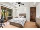Bedroom with ceiling fan, large window and natural lighting at 7552 E Whisper Rock Trl, Scottsdale, AZ 85266