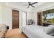 Bedroom features a large window, ceiling fan and an ensuite bathroom at 7552 E Whisper Rock Trl, Scottsdale, AZ 85266
