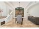 Elegant dining room featuring a chandelier, neutral walls and floors, and natural light at 7552 E Whisper Rock Trl, Scottsdale, AZ 85266