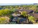 Aerial view of a luxurious property featuring extensive stone work and beautiful landscaping at 7552 E Whisper Rock Trl, Scottsdale, AZ 85266