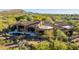 A high-angle view of a private residence with a pool and lush landscaping at 7552 E Whisper Rock Trl, Scottsdale, AZ 85266