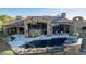 Bird's eye view of a luxury home featuring a pool, patio, and outdoor living areas at 7552 E Whisper Rock Trl, Scottsdale, AZ 85266