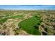 Immaculately kept golf course surrounded by mature landscaping, sand traps and pristine greens at 7552 E Whisper Rock Trl, Scottsdale, AZ 85266