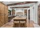 Spacious kitchen featuring a large center island with stone countertops and custom wood cabinetry at 7552 E Whisper Rock Trl, Scottsdale, AZ 85266