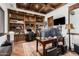 Spacious office with built in bookshelves, hardwood floors, and a large desk at 7552 E Whisper Rock Trl, Scottsdale, AZ 85266