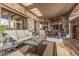 Large outdoor space with seating, outdoor kitchen and stone architecture at 7552 E Whisper Rock Trl, Scottsdale, AZ 85266