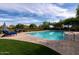 Resort-style pool surrounded by manicured landscaping and comfortable lounge chairs offers the perfect outdoor oasis at 7552 E Whisper Rock Trl, Scottsdale, AZ 85266