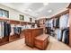 Spacious walk-in closet with custom wood shelving and ample storage space at 7552 E Whisper Rock Trl, Scottsdale, AZ 85266