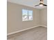 Bedroom featuring neutral paint, a window, and a ceiling fan at 7607 N 42Nd Ln, Phoenix, AZ 85051