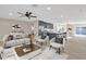 A stylish living area with a kitchen, modern decor, and lots of natural light at 7607 N 42Nd Ln, Phoenix, AZ 85051